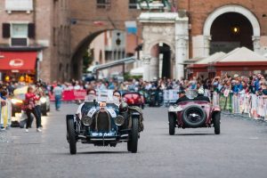 Mille Miglia: a Bugatti passes through the city centre of Ferrara