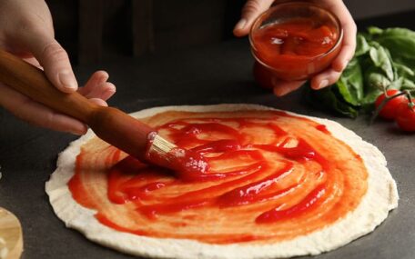 tomato sauce on pizza